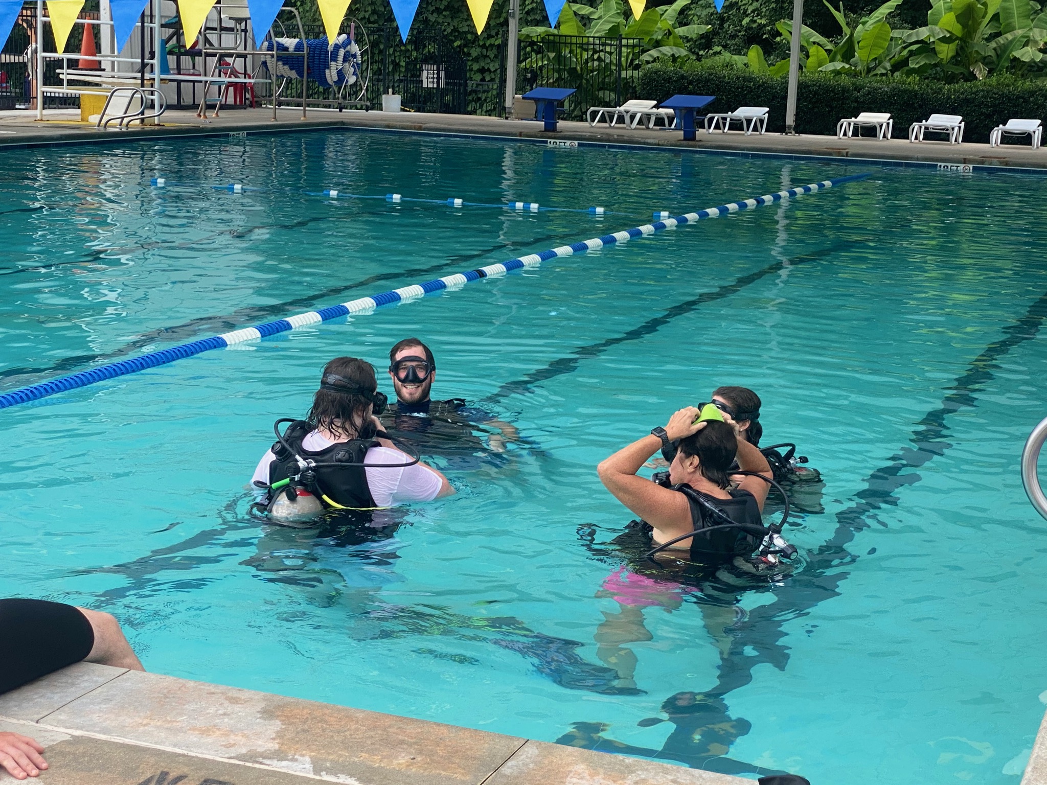 A scuba class taking place in a public pool