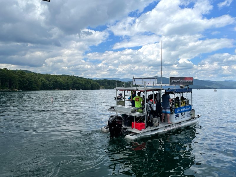 Small boat of divers on a lake